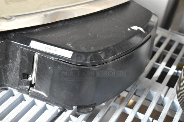 2016 Hobart HTi-7LH metal countertop scale with label printer, black base, minor wear, labeled "Scale 07," 120/208-240V.