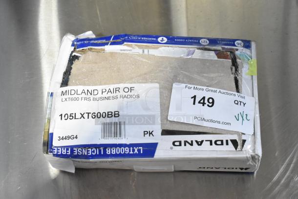 Midland 105LXT600BB FRS Business Radio package, slightly damaged box, barcode, and auction label visible.