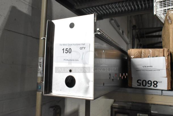 Brand new Backyard Pro metal grill with minor scratches and dents. Auction tag: Qty 150, PCAuctions.com. Ideal for outdoor cooking.