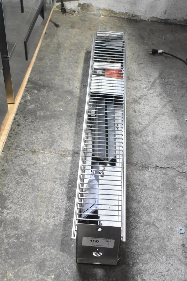 Brand new Backyard Pro metal grill with minor scratches and dents. Long rectangular design, visible label indicating auction info.