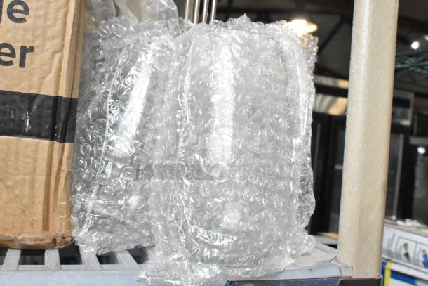 7 new scratch and dent items, including Kason door closer, Frymaster twin fryer basket, beverage dispenser, bubble-wrapped.