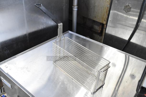 Frymaster 8030304 Twin Size Fryer Basket, stainless steel, 16.75" x 8.75" x 6", new condition, on stainless surface.