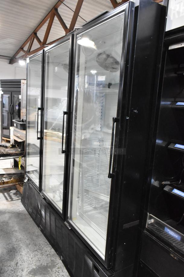 Master-Bilt BLG-74HD 3-door reach-in freezer merchandiser with poly-coated racks, black metal, 208-230V, 1 phase.