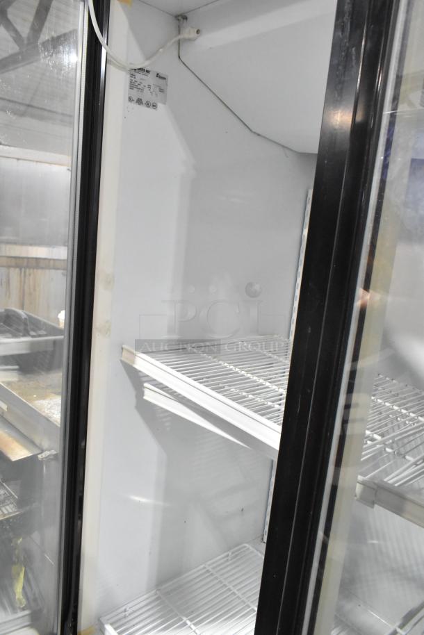 Master-Bilt BLG-74HD reach-in freezer, 3 glass doors, poly-coated racks, good condition, 208-230 volts, 1 phase.