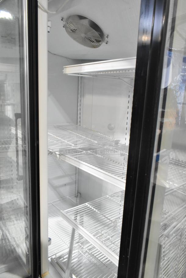 Master-Bilt BLG-74HD 3-door commercial reach-in freezer, poly-coated racks, 208-230V, interior view, excellent condition.
