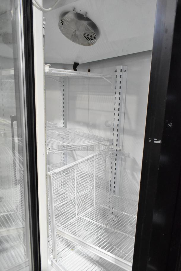 Master-Bilt BLG-74HD 3-door reach-in freezer with poly coated racks, metal build, 208-230V, clean interior, fan visible.