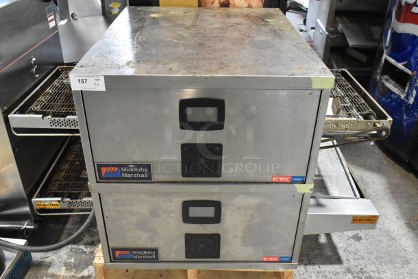 2021 Middleby Marshall CTX DZ33T stainless steel conveyor pizza ovens on casters. 208V, 3/1 Phase. Visible wear.