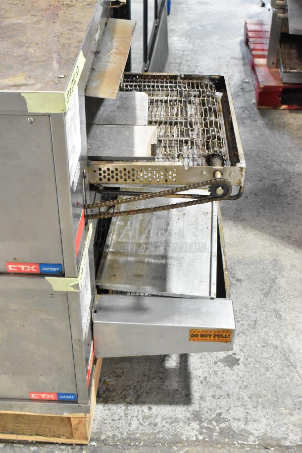 2 Middleby Marshall CTX DZ33T stainless steel conveyor pizza ovens on casters, 208V, 3/1 phase, "Do Not Pull" label visible.