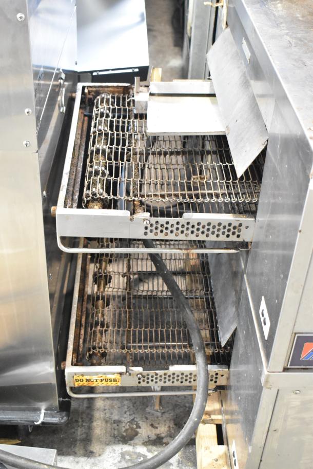 Middleby Marshall CTX DZ33T stainless steel conveyor pizza oven, electric, commercial casters, visible wear. "Do Not Push" label.