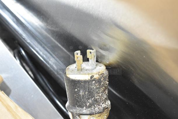 Close-up of worn, dirty electrical plug for Middleby Marshall CTX DZ33T conveyor pizza oven. Plug shows signs of use.