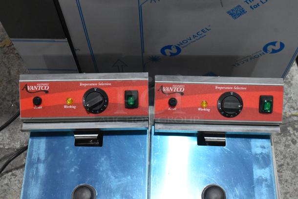 Brand new Avantco 177F202 stainless steel 30 lb. dual tank fryer with temperature controls, reset buttons, and indicators.