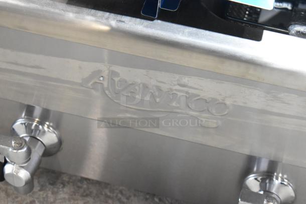 Stainless steel Avantco fryer, model 177F202, with "Avantco" logo. Features dual tanks and metal fry baskets.