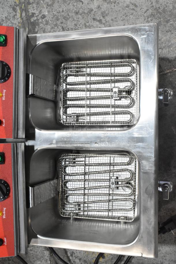 Brand new Avantco 177F202 stainless steel dual tank electric fryer with metal baskets and lids. Scratch and dent model.