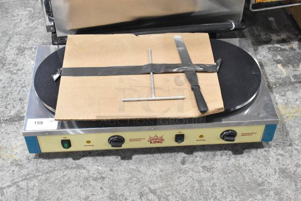 Brand new Carnival King 382TCM16DBL dual non-stick crepe maker, 208/240V, with cardboard cover and spatula, stainless steel base.