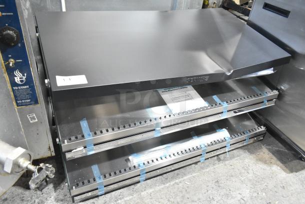 BRAND NEW ServIt 423OAM138D 48" heated display merchandiser, slanted, 2 shelves, 120V, minor dents.