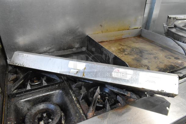 Vulcan V2BG4TS stainless steel commercial flat top griddle with 4 burner range, oven, backsplash on casters. 50,000 BTU.