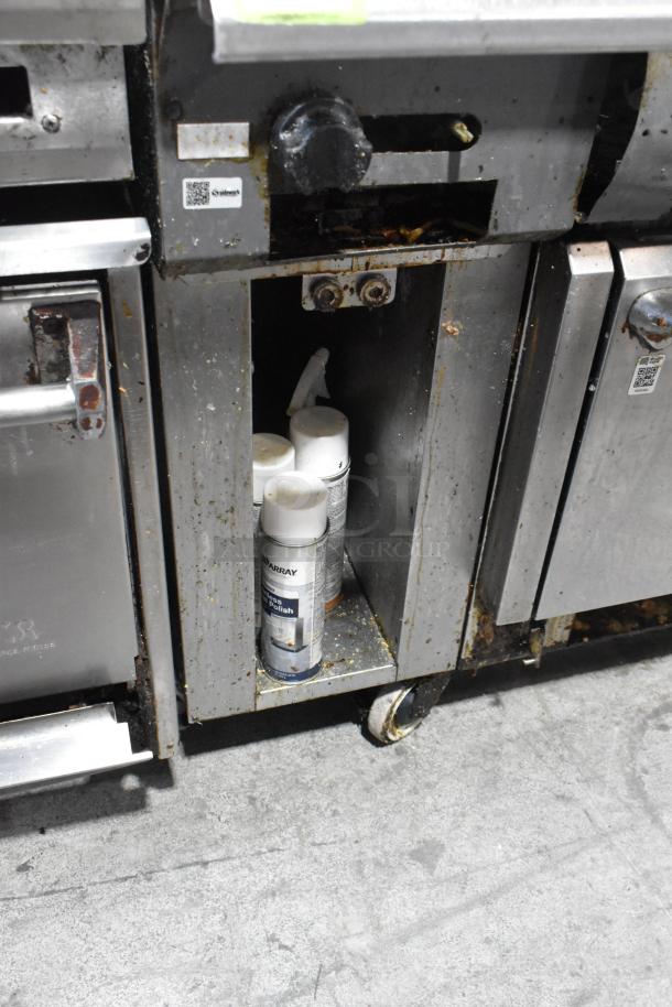 Vulcan V2BG4TS stainless steel griddle with 4-burner range and oven, natural gas, 50,000 BTU, on casters, fair condition.