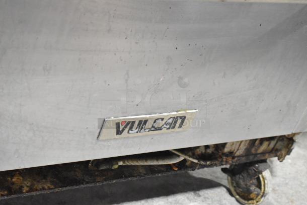 Vulcan V2BG4TS stainless steel griddle with 4-burner range, oven, backsplash, commercial casters, 50,000 BTU. Used condition.
