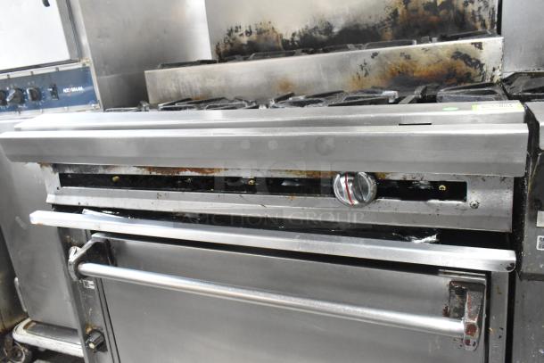 Stainless steel commercial gas flat top griddle with 2 tier 6 burner range, oven, backsplash, on commercial casters, 50,000 BTU.