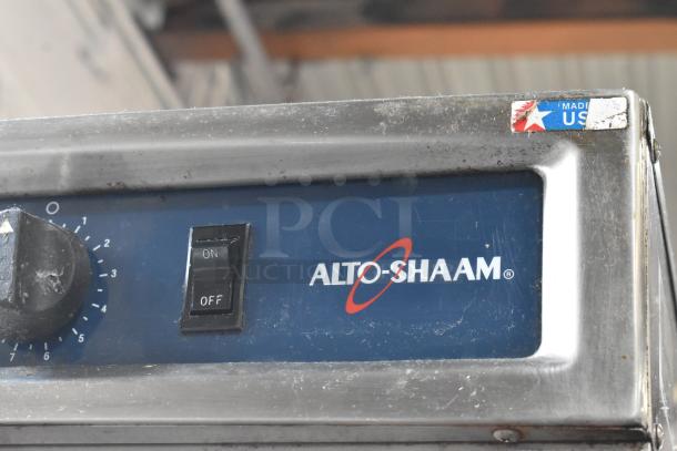 Alto Shaam 1000-TH/I stainless steel cook and hold oven with classic controls, commercial casters, and "Made in USA" label.