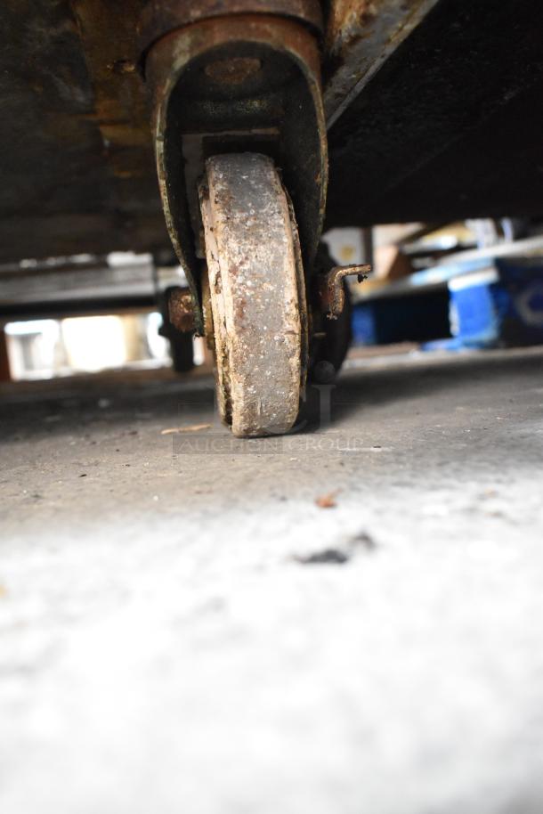 Alto Shaam 1000-TH/I commercial oven caster, showing signs of wear and rust, suitable for restoration or replacement.