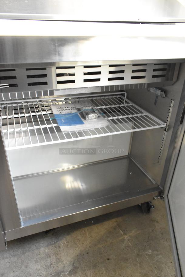 Avantco 178APT60MHC stainless steel sandwich prep table, new scratch and dent, commercial casters, interior shelving.