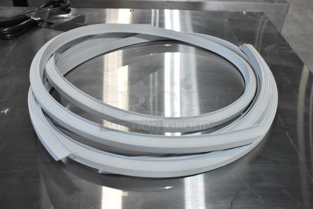 BRAND NEW SCRATCH AND DENT Gray Seal, coiled, on metallic surface. Unused condition despite minor blemishes.