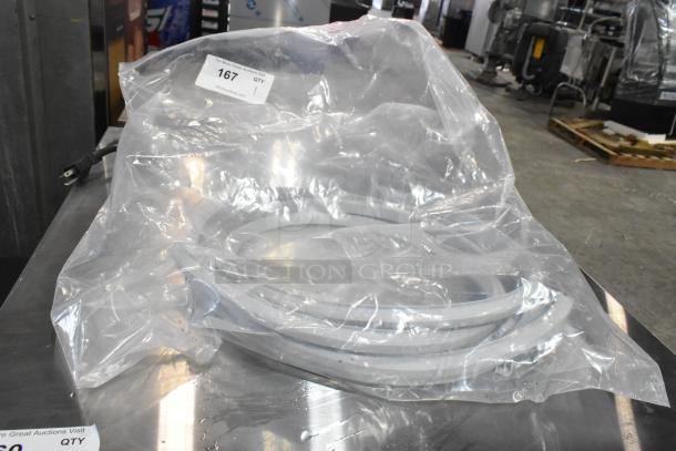 Brand new gray seal in original packaging, labeled "Scratch and Dent." Tag with auction number 167 visible.