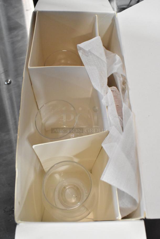 Brand new Stolzle Glencairn whiskey tasting set with tray in original packaging, showing glasses inside. Minor packaging damage.