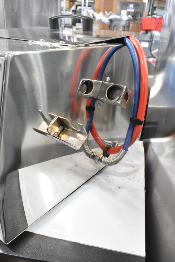 Brand new Pavoni Ciocospritz stainless steel countertop chocolate sprayer. Dimensions: 16.5"x15.75"x15.75". 110V, 1 Phase.