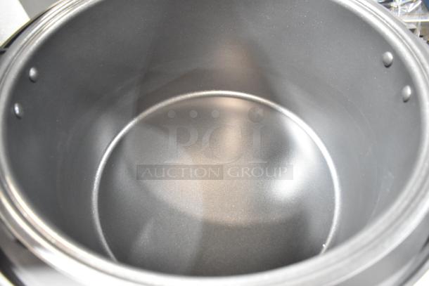 Avantco 177RCSB90 rice cooker interior, brand new with minor scratches. Stainless steel, 90 cup capacity, 240V, digital controls.