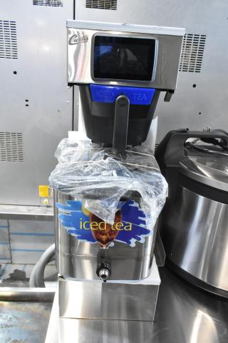 Brand new Curtis G4TBP Polaris stainless steel commercial 3-gallon tea brewer, low profile, 120V, with "Iced Tea" label.