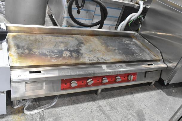 Avantco 177EG60C stainless steel flat top griddle, electric, 208V, 3-phase, with visible wear, five control knobs.