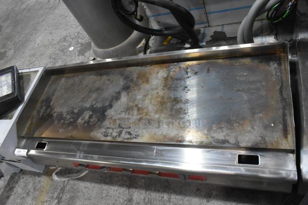 Avantco 177EG60C stainless steel electric griddle, commercial countertop model; shows wear, 208V, 3-phase.