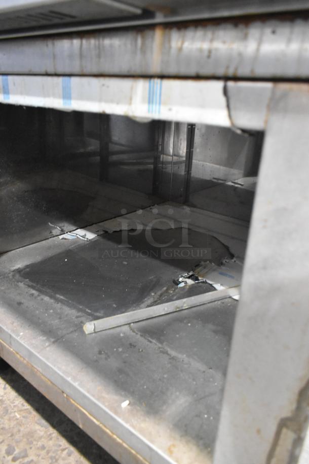 Mono FG180C-UZ56 stainless steel commercial convection oven on casters, visible undershelf, used condition, 208V, 3 Phase.
