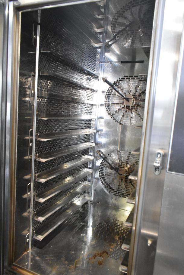 Mono FG180C-UZ56 BX stainless steel combi convection oven, interior view, with shelves, fans, under shelf, and commercial casters.