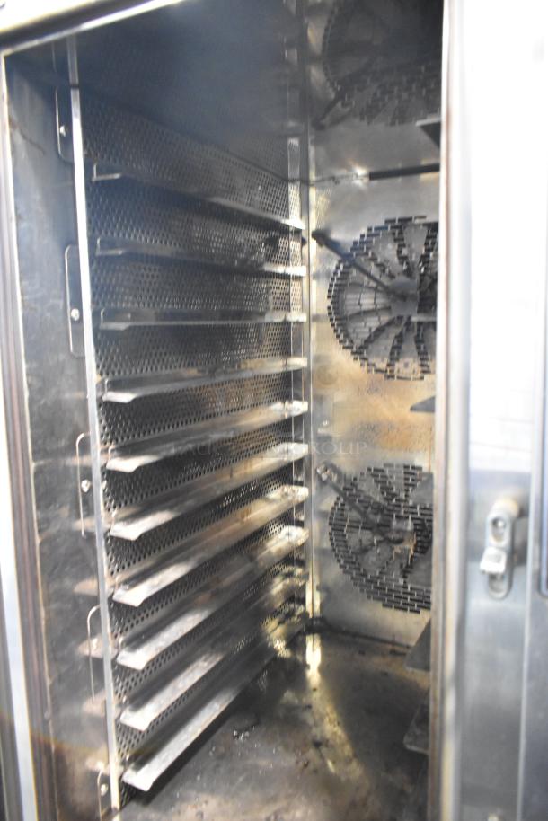 Mono FG180C-UZ52 stainless steel combi convection oven, interior view, multiple racks, commercial casters, 208V, 3 phase.