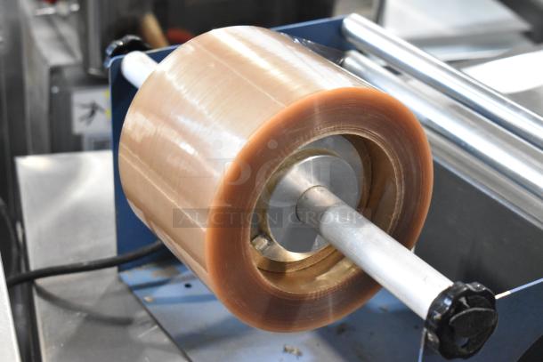 Kopak 4106-1000 metal commercial shrink wrapper, 110V, 1 phase, showing roll holder with shrink film.