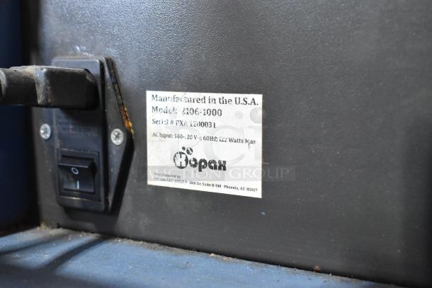 Kopak 4106-1000 metal commercial countertop shrink wrapper label showing voltage and manufacturing details. Model visible.