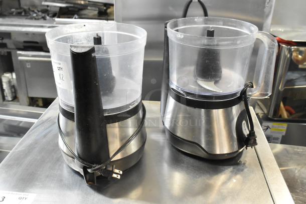 Two countertop food processors without lids, stainless steel base, 115 volts, 1 phase, cords attached.