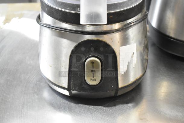 Two countertop food processors, no lids, 115 volts, 1 phase, stainless steel finish, on/off/pulse button visible.