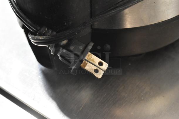 Close-up of a plug for a countertop food processor; no lid shown, operates at 115 volts, 1 phase. Auction 2 times your bid.