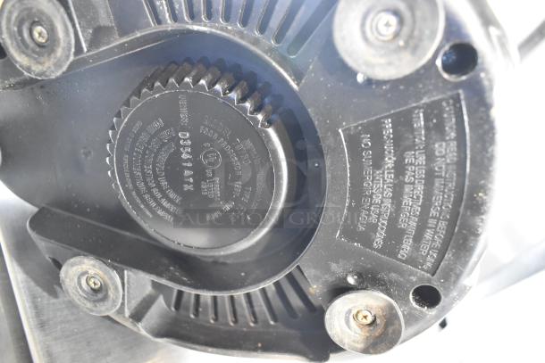 Two countertop food processors without lids, 115 volts, 1 phase. Close-up shows model details and safety labels.