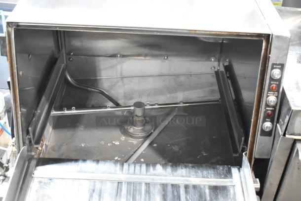 Stainless steel commercial undercounter glass washer, open, showing wash area and control panel with buttons labeled Start, Cycle, Power, and Fill.