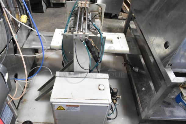 Package Metal Countertop Die Fold Wrapper Machine, shown in industrial setting, with attached wiring and visible warning label.