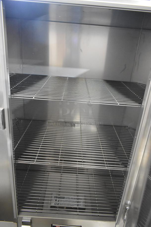 Metro MBQ-120 stainless steel heated banquet cabinet, new with minor scratches, holds 120 plates, on commercial casters.