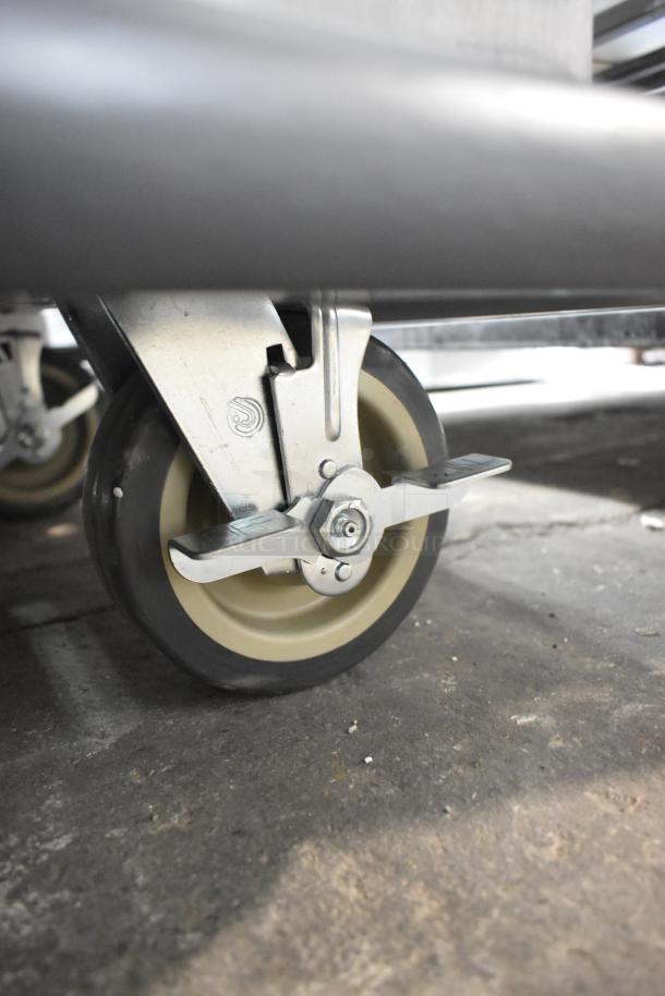 Stainless steel Metro MBQ-120 heated banquet cabinet with commercial casters shown, brand new, holds 120 plates.