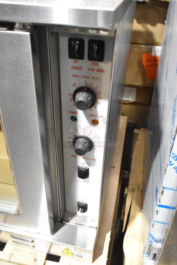 BRAND NEW Cooking Performance Group stainless steel convection oven model FEC-100-D. Features power, heat indicators, and control knobs.