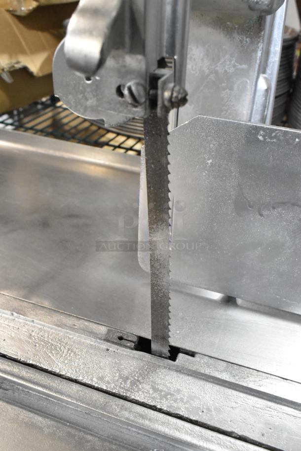 Biro 11 Metal Commercial Floor Style Meat Saw with visible blade and mechanics, industrial-grade condition.