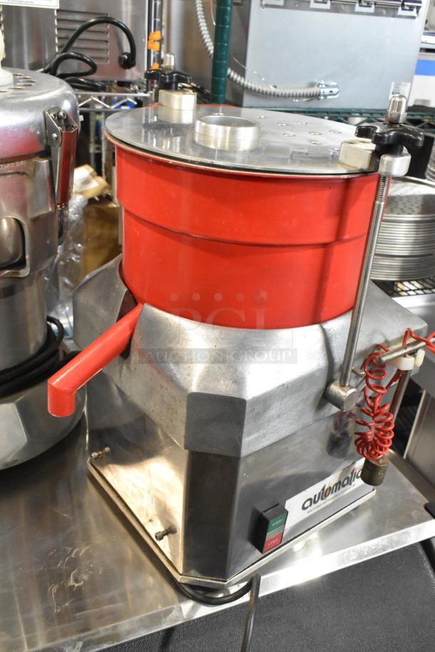 Automatic MJ Metal Commercial Countertop Food Processor, red and silver, showing start/stop buttons, in used condition.